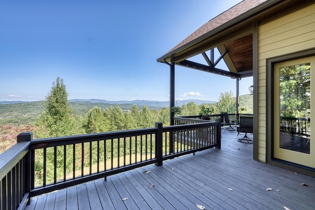 wooden deck featuring a mountain view