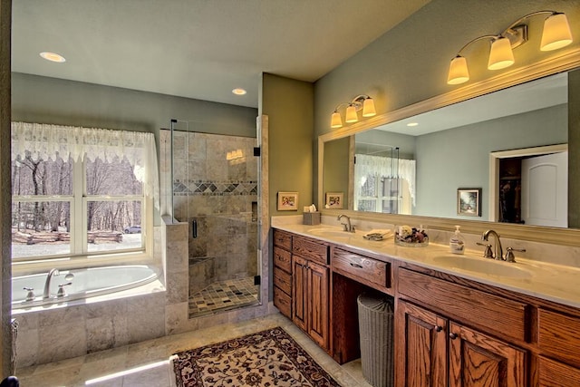 bathroom with tile patterned flooring, vanity, and separate shower and tub