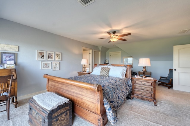 bedroom with ceiling fan, light colored carpet, and vaulted ceiling