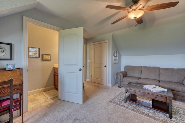 living room featuring a textured ceiling, ceiling fan, lofted ceiling, and light carpet