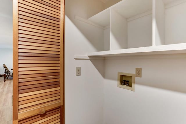 laundry room featuring light wood-type flooring and hookup for a washing machine