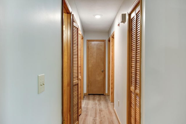 hall with light wood-type flooring