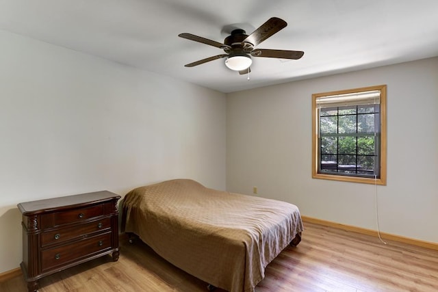 bedroom featuring ceiling fan and light hardwood / wood-style floors