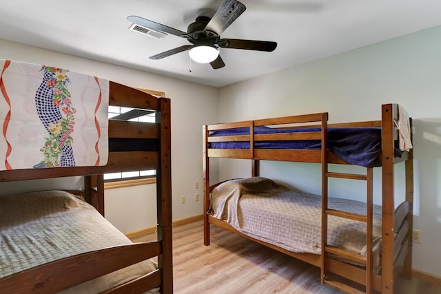 bedroom featuring light hardwood / wood-style floors and ceiling fan