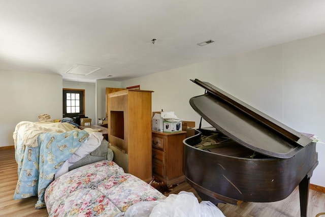 bedroom with light wood-type flooring