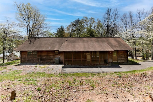 view of side of home featuring central AC