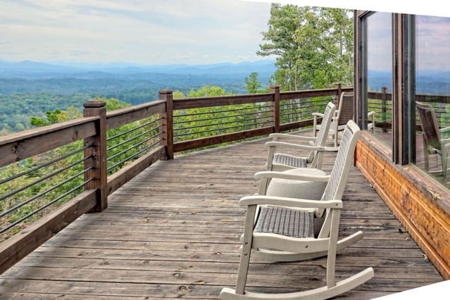 wooden terrace featuring a mountain view