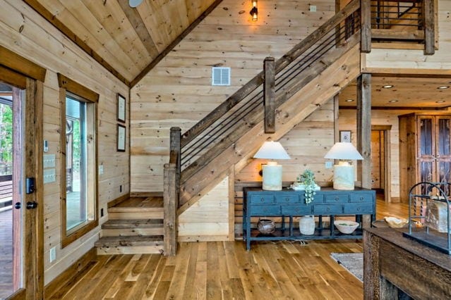 foyer with wooden walls, vaulted ceiling, hardwood / wood-style floors, and wood ceiling