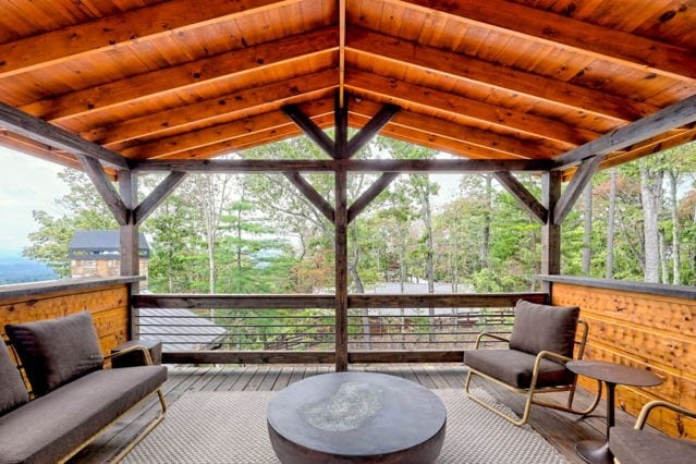 sunroom / solarium with a healthy amount of sunlight and beamed ceiling