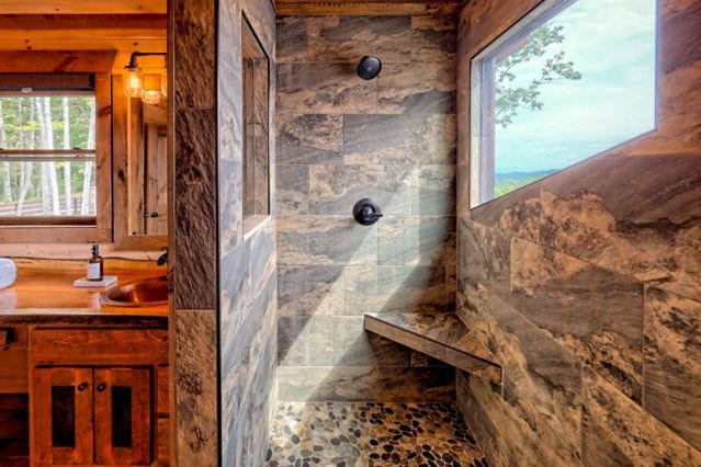 full bathroom featuring a walk in shower and vanity