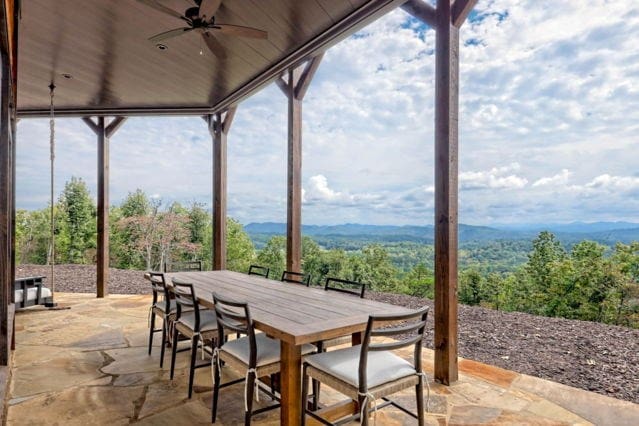 view of patio featuring outdoor dining area and a ceiling fan