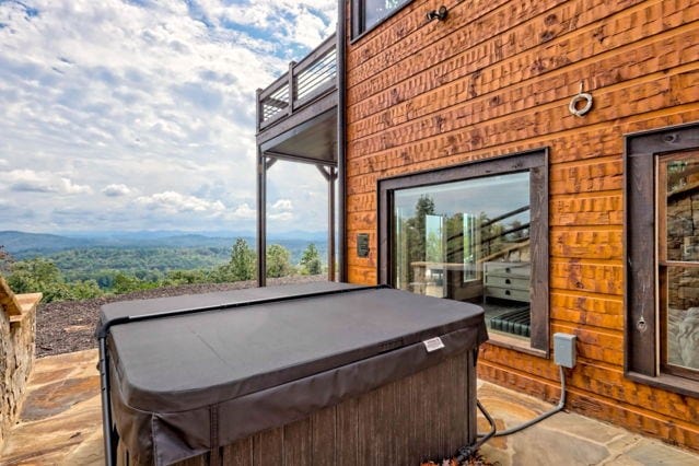 exterior space featuring a hot tub