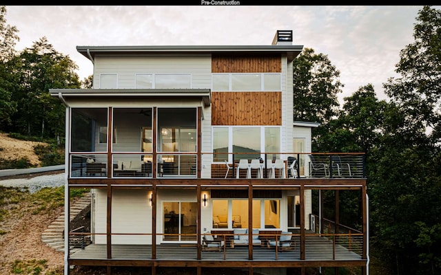 rear view of house featuring a balcony