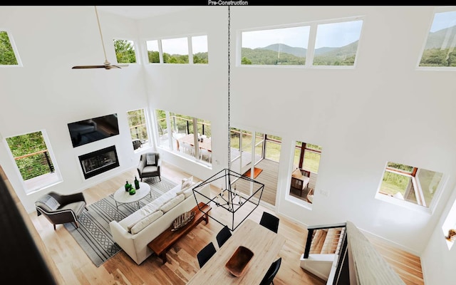 living room featuring a wealth of natural light and a towering ceiling