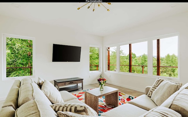 living room with an inviting chandelier