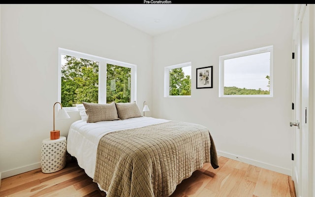 bedroom with light hardwood / wood-style floors