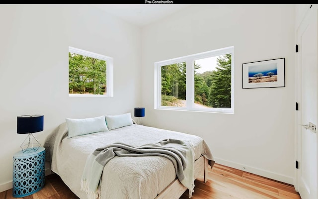 bedroom with light wood-type flooring