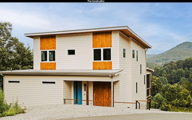 view of front of property with a mountain view