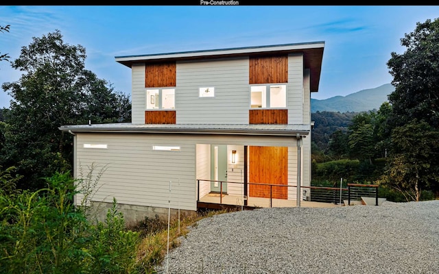 rear view of house with a mountain view