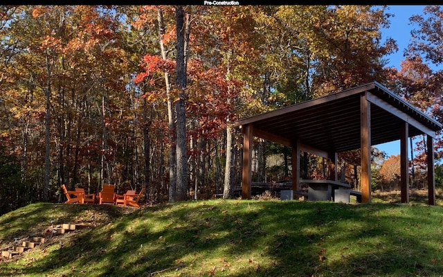 view of property's community with a yard