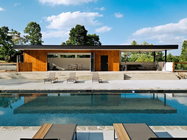 view of swimming pool with a patio area