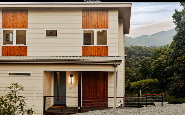 view of front of property with a mountain view