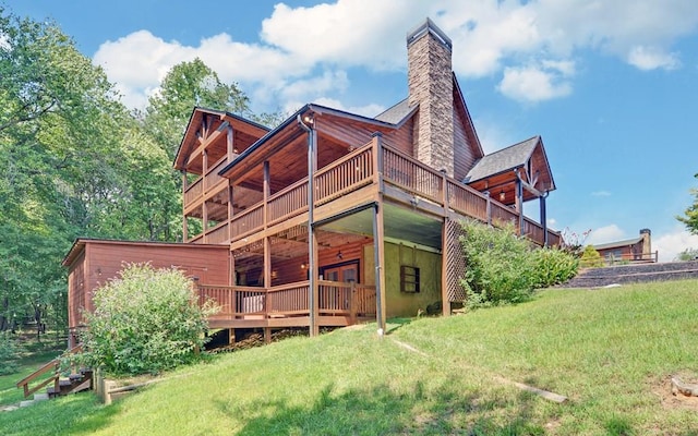 166 Dallas Ln, Blue Ridge, GA 30513 - back of house featuring a lawn, a chimney, and a deck