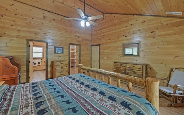 166 Dallas Ln, Blue Ridge, GA 30513 - bedroom with visible vents, wood walls, wooden ceiling, lofted ceiling, and ensuite bathroom