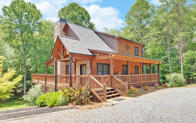 166 Dallas Ln, Blue Ridge, GA 30513 - log cabin with faux log siding, a shingled roof, a chimney, and a porch