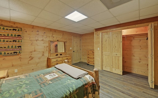 166 Dallas Ln, Blue Ridge, GA 30513 - bedroom featuring wood walls, a drop ceiling, and a closet