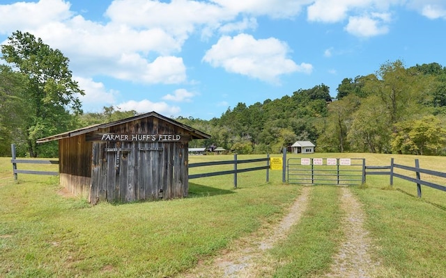 166 Dallas Ln, Blue Ridge, GA 30513 - view of yard with fence, an outbuilding, and a gate