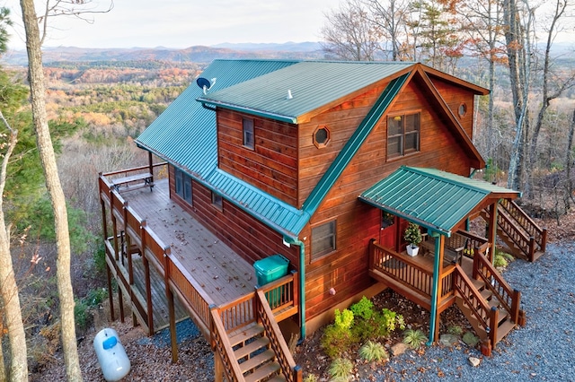 back of property featuring a mountain view