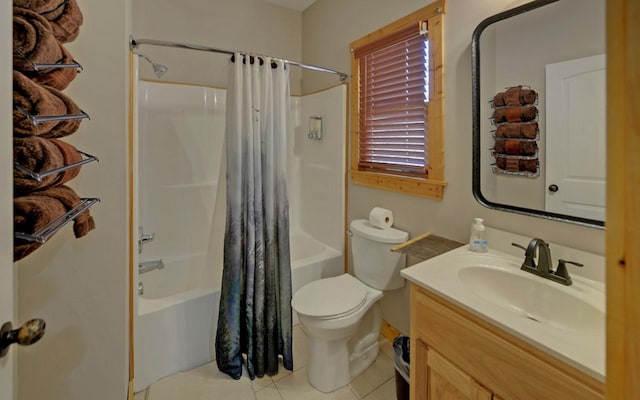 full bathroom featuring tile patterned flooring, toilet, vanity, and shower / bath combo with shower curtain