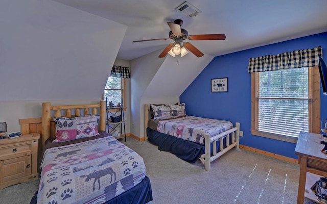 bedroom with vaulted ceiling, baseboards, visible vents, and carpet floors