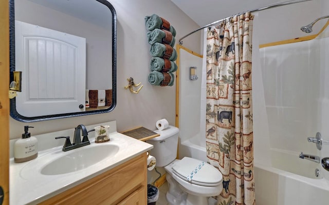 bathroom featuring toilet, vanity, and shower / bath combo