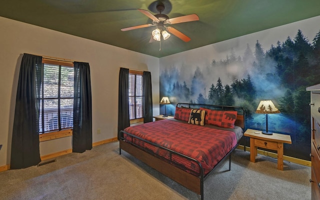 bedroom with visible vents, baseboards, ceiling fan, and carpet flooring