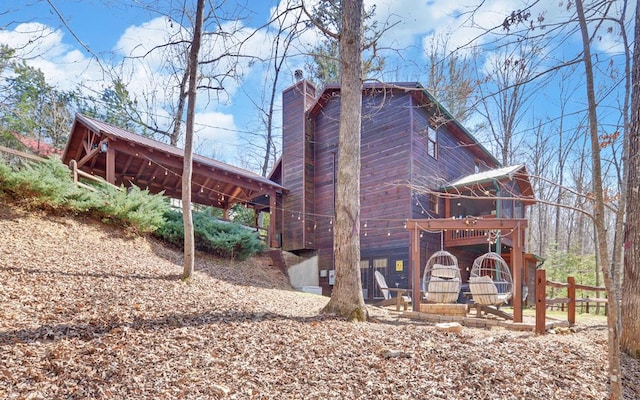 view of side of home with a chimney