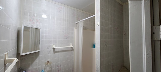 bathroom with walk in shower and tile walls