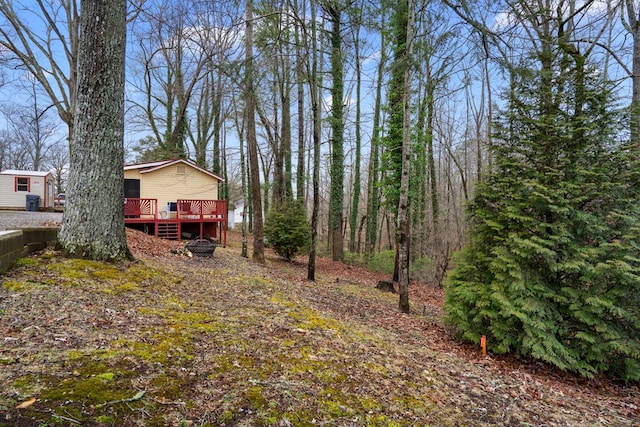 view of yard with a wooden deck