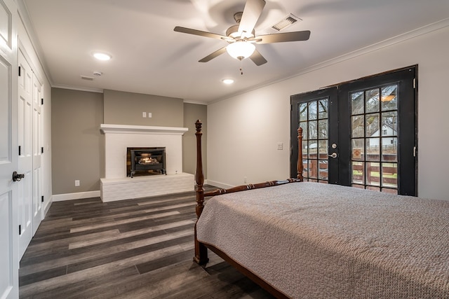 bedroom with ornamental molding, french doors, visible vents, and dark wood-style floors