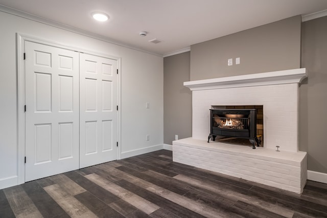 unfurnished living room with baseboards, visible vents, ornamental molding, and dark wood-type flooring