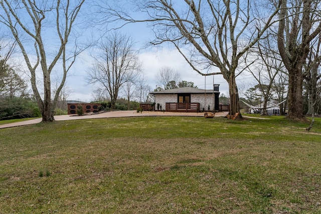 view of yard featuring a deck