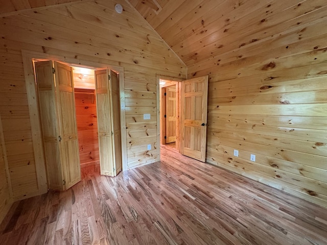 151 Martins Creek Ridge Rd, Murphy, NC 28906 - unfurnished bedroom with lofted ceiling, wood walls, wooden ceiling, and light wood finished floors