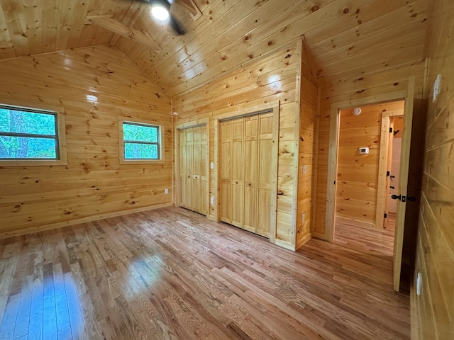 151 Martins Creek Ridge Rd, Murphy, NC 28906 - unfurnished bedroom with wooden walls, vaulted ceiling, wood-type flooring, wood ceiling, and multiple closets