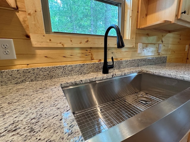151 Martins Creek Ridge Rd, Murphy, NC 28906 - kitchen view of a sink, wood walls, and light stone counters