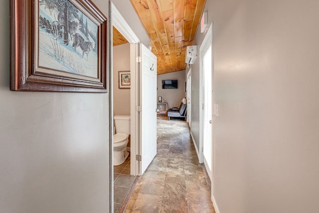 corridor featuring a healthy amount of sunlight and wood ceiling