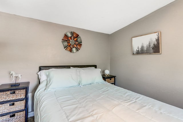 bedroom with lofted ceiling