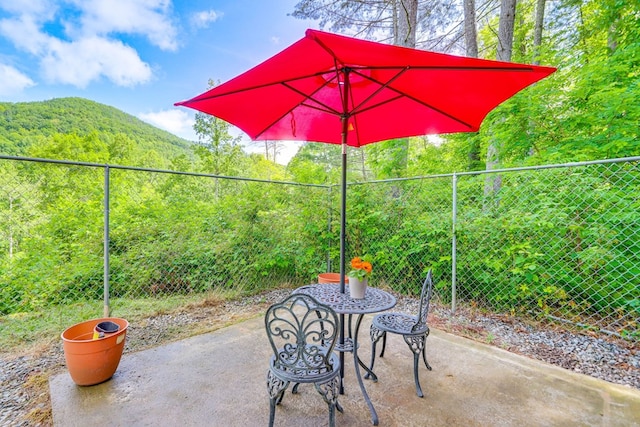 view of patio / terrace with a mountain view