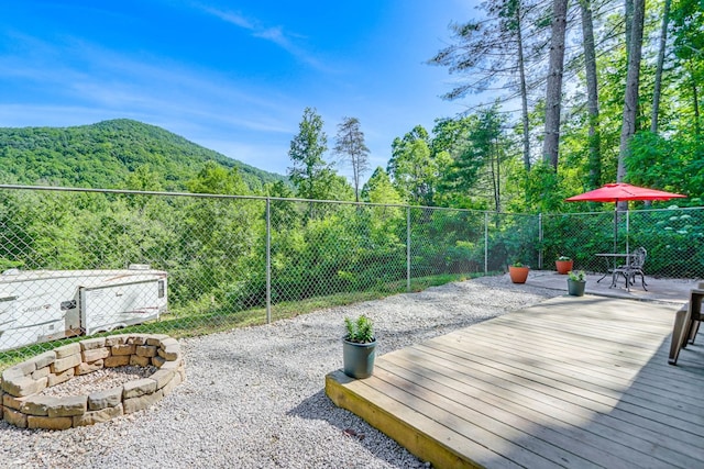 view of patio / terrace featuring a deck with mountain view