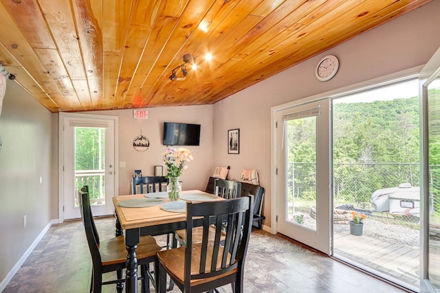 dining space with wooden ceiling and vaulted ceiling